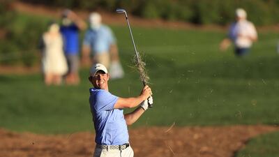 McIlroy plays a shot on the 18th hole. AFP