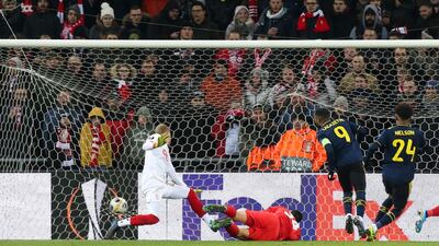 Arsenal's Alexandre Lacazette, second right, scores past Liege goalkeeper Arnaud Bodart at the Maurice Dufrasne stadium. AP