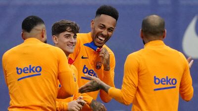 FC Barcelona players (L-R) Memphis Depay, Gavi, Pierre-Emerick Aubameyang, and Dani Alves attend their team's training session at Joan Gamper Sports City facilities in Barcelona, Spain, 19 March 2022. FC Barcelona will face Real Madrid in their Spanish La Liga soccer match, traditionally known as 'El Clasico', on 20 March 2022. EPA / Enric Fontcuberta