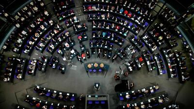 German MPs attend a special parliament session at the Reichstag building. AP Photo