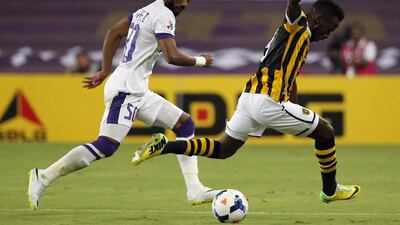 Al Ain defender Mohammed Fayez,left, chases down Al Ittihad forward Fahad Al Muwallad during the first leg of their Asian Champions League quarter-final play-off last Wednesday. Karim Sahib / AFP / August 19, 2014