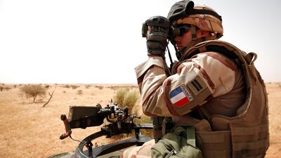 A French soldier uses his binoculars during Operation Barkhane in Inaloglog, Mali. Reuters
