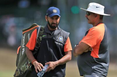 India batsman Cheteshwar Pujara, left and head coach Ravi Shastri. AP Photo