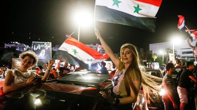 Syrians celebrate in the streets of the capital Damascus, a day after an election that is set to give Bashar Al Assad a fourth term as president. It was the second presidential vote in Syria since the start of a civil war in 2011 in which more than 388,000 people have been killed. AFP