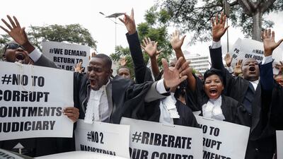 Lawyers of the Law Society of Zimbabwe bar association take part in a "March for Justice" in Harare. AFP