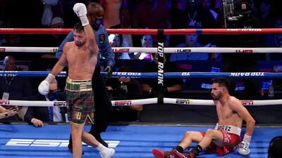 Josh Taylor walks away after knocking down Jose Ramirez during their light-welterweight title fight in Las Vegas on Saturday, May 22. Taylor won a unanimous points decision to become Britain's first undisputed four-belt world champion. PA