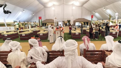 Farmers attend the first day of the Liwa Date Auction. Antonie Robertson / The National