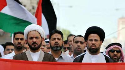 Ayatollah Sheikh Hussein al Najati (left, foreground) has been stripped of his passport in an action taken yesterday.