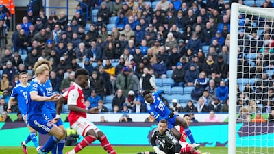 Arsenal's Gabriel Martinelli, right, scores past Leicester's goalkeeper Danny Ward. AP