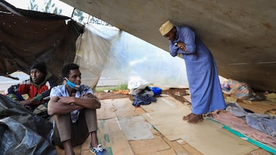 A Congolese refugee Muhamed Al-Ahadal (R), makes his evening prayers under a footbridge where he and other refugees sleep next to a highway, ahead of World Refugee Day in Nairobi, Kenya . World Refugee Day is marked annually on 20 June to raise awareness of the situation of refugees around the world. According to the UNHCR, more and more refugees today live in urban settings outside refugee camps. EPA