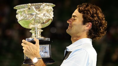 Federer holds the trophy after winning his final match against Fernando Gonzalez of Chile in 2007. Getty