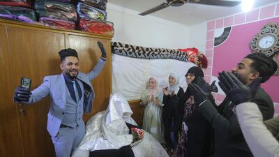 Ahmed Khaled Al Kaabi and his bride Ruqaya Rahim celebrate their wedding in Najaf, Iraq. AP Photo