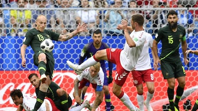 Australia's Aaron Mooy, left, clears a ball. Martin Meissner / AP Photo
