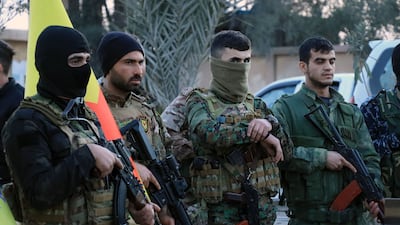 Members of the Syrian Democratic Forces (SDF) deploy outside Ghwayran prison in Syria's northeastern city of Hasakeh on January 26, 2022, after having declared over the facility following its takeover by Islamic State (IS) group forces. Kurdish forces on January 26 retook full control of the prison in northeast Syria where Islamic State group jihadists had been holed up since attacking it six days earlier. The brazen IS jailbreak attempt and ensuing clashes left more than 180 dead in the jihadists' most high-profile military operation since the loss of their "caliphate" nearly three years ago. AFP