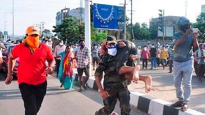 Rescuers evacuate people following a gas leak incident at an LG Polymers plant in Visakhapatnam. AFP