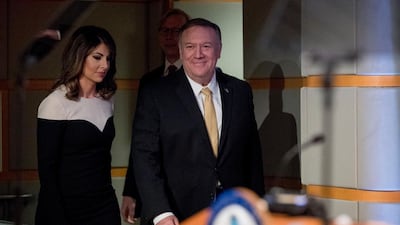 Secretary of State Mike Pompeo, right, accompanied by State Department spokeswoman Morgan Ortagus arrives for a news conference at the State Department in Washington. AP Photo