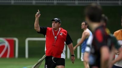 Jan Venter, the Dubai Exiles coach, takes a training session at the Sevens rugby ground in Dubai.