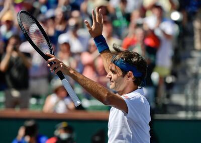 Roger Federer waves to fans after winning his quarter-final match against Hubert Hurkacz at Indian Wells. Mark J Terrill / AP Photo