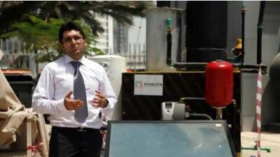 Ammar Alsheghri, along with his colleagues Abdullah Al Hammadi and Mohammed Humood (not pictured), showcased their Solar Thermal Desalination Unit. Lee Hoagland/The National