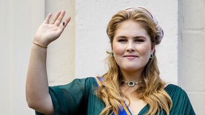 Crown Princess Amalia waves from a balcony of Noordeinde Palace in The Hague, the Netherlands. EPA