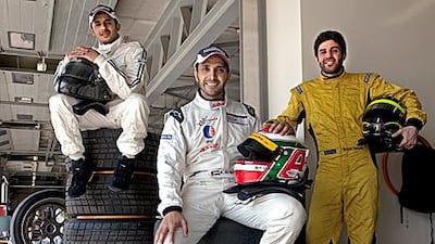 From left, Porsche GP drivers Musaed al Murar, Khaled al Qubaisi, both driving for Tolimit Arabia and Ibrahim Salloum in the garage during a break from their test drives at the Dubai Autodrome.
