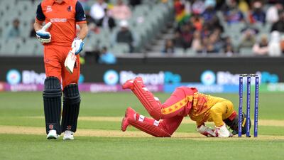 Netherlands' Bas de Leede runs as Zimbabwe's Regis Chakabva collects at the Adelaide Oval. AFP