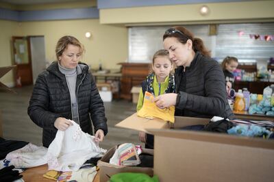 Ukrainian refugees volunteer at the Ukrainian Cultural Centre sorting humanitarian aid for compatriots in the UK and Ukraine. Getty Images