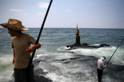 A Lebanese fisherman loosk out across the Mediterranean Sea. Lebanon and Israel are locked in a long-running maritime border dispute. Nicole Hill / The National