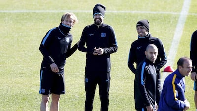 Luis Suarez, right, Gerard Pique, centre, and Ivan Rakitic. Yuya Shino / Reuters