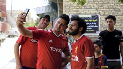 Iraqi footballer Hussein Ali, who plays for the Iraqi Al Zawraa FC, is a lookalike of Liverpool's Egyptian forward Mohamed Salah. Sabah Arar / AFP