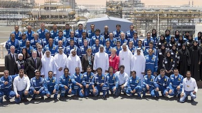 Sheikh Mohammed bin Zayed, centre, Crown Prince of Abu Dhabi and Deputy Supreme Commander of the UAE Armed Forces, with other government officials and dignitaries stand for a photograph with Al Hosn employees. Mohamed Al Hammadi / Crown Prince Court - Abu Dhabi