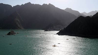 People enjoying boat rides, kayaking and other adventure activities at Hatta Dam, Dubai. Pawan Singh / The National