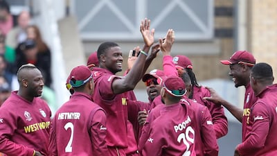 West Indies' captain Jason Holder celebrates with teammates taking the wicket of Pakistan's captain Sarfaraz Ahmed. AP Photo