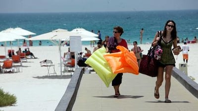 Sun-lovers head to the Saadiyat Island Beach in Abu Dhabi on the long weekend of Isra Wal Miraj. Sammy Dallal / The National