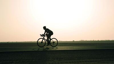 Sports fan Emma Woodcock, at the Al Qudra track near Bab Al Shams, cycles year round, even through the summer months. Antonie Robertson / The National