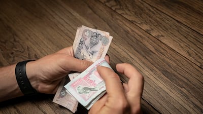 The habit of paying yourself first or saving before spending will help reach your goals faster, experts say. Antonie Robertson / The National