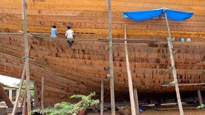 Dying art: Workers at Mohammed Bu Haji's boatyard in Ras al Khaimah. Many of the country's dhow workshops have closed or changed their focus to fibreglass boats in the past few years.