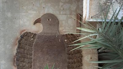 An old sign in the shape of the UAE falcon in Tanker Mai has been rendered in hardboard and plywood. Delores Johnson / The National