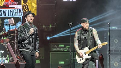 Joel Madden, left, and twin brother Benji of Good Charlotte perform live in Ohio last year. The band have written their tightest, most personal album to date. AP