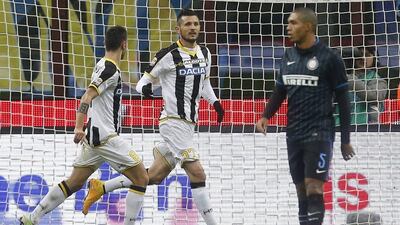 Udinese's Cyril Thereau, centre, celebrates after scoring the eventual winner in his side's 2-1 Serie A victory over Inter Milan on Sunday. Alessandro Garofalo / Reuters / December 7, 2014