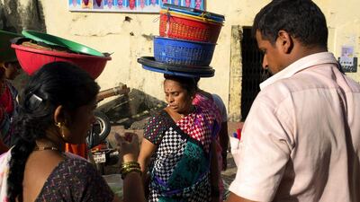 Women trade in a wide variety of fish at Sassoon Docks. Subhendu Sarkar / Getty Images