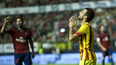 Cesc Fabregas, right, reacts after missing a shot during Saturday's scoreless draw with Osasuna. Alvaro Barrientos / AP
