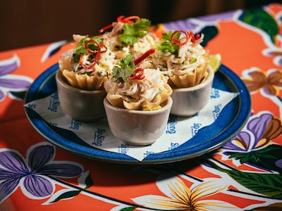 OG crab cups with green mango salad and coconut dressing is a menu highlight. Photo: Sip Song