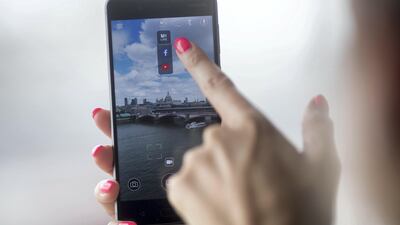 A worker demonstrates live filming capabilities of the Nokia 8 smartphone. Simon Dawson/Bloomberg