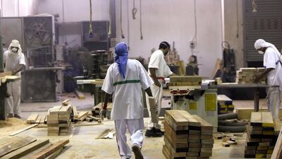 Inmates work in the carpentry shop at the General Department of Correctional Institutions in Dubai. The UAE and Bangladesh are expected to sign a prisoner-swap agreement very shortly. Satish Kumar / The National