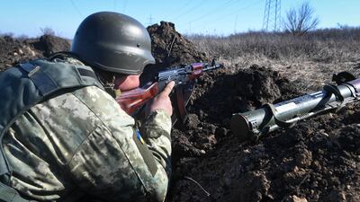 Ukrainian soldiers patrol the road near Kharkiv, Ukraine, as the Russian invasion continues. EPA