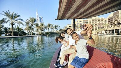 Tourists take an Abra ride through Dubai's Madinat Jumeirah resort. Dubai hotels recorded occupancy rates of 60.5 per cent in March, up from 58.2 per cent in February, according to STR. Courtesy: Dubai Tourism.