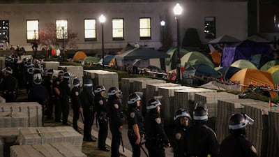 Police stand guard near a camp of protesters supporting Palestinians on the grounds of Columbia University. Reuters