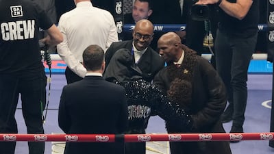 Nigel Benn (centre) and Chris Eubank Sr in the ring before the middleweight bout between Chris Eubank Jr and Conor Benn. PA