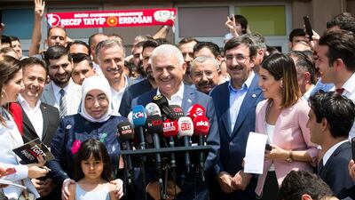 Mr Yildirim reacts as he addresses the media and his supporters. Gurcan Ozturk / AFP